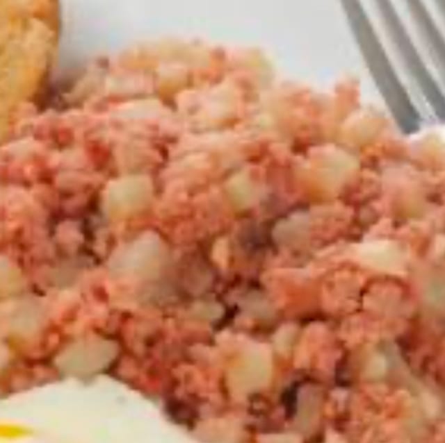 SIDE OF HOMEMADE CORN BEEF HASH.