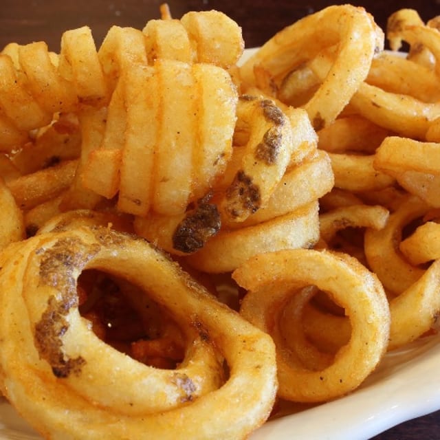 CURLY FRIES.